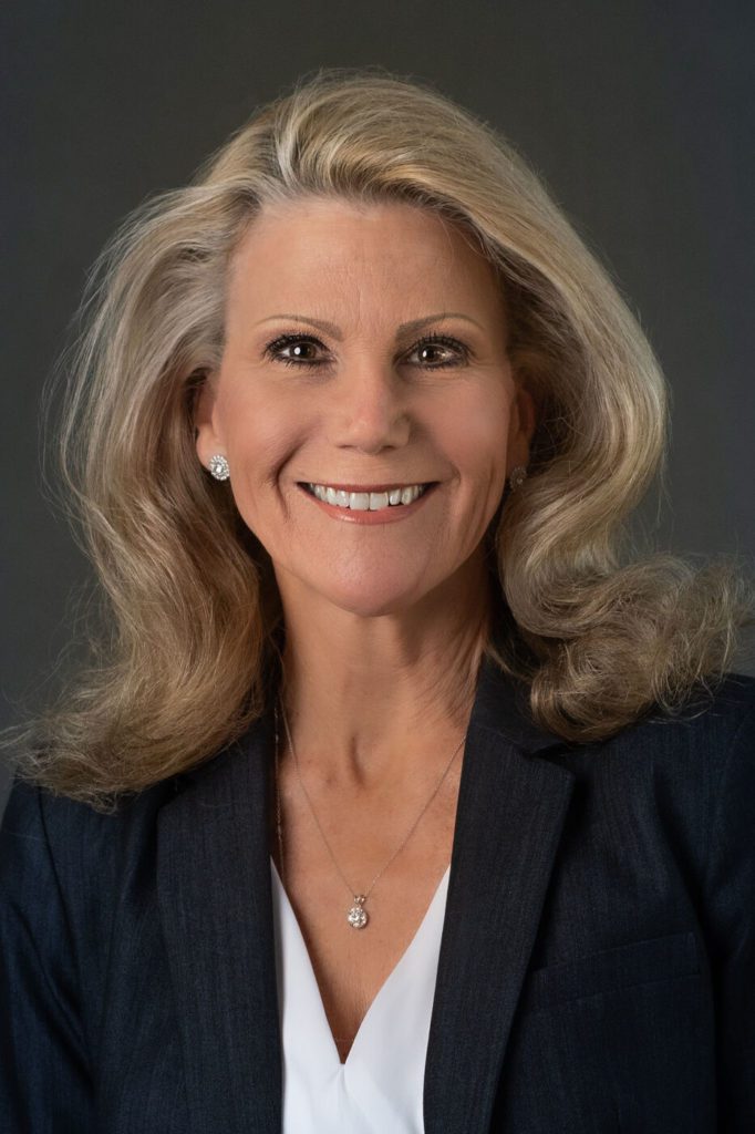 Headshot of a woman in a suit