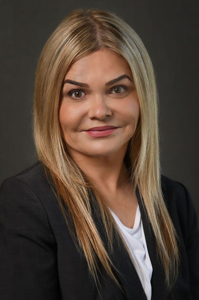 Headshot of a woman in a suit