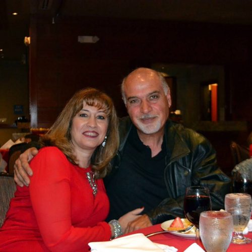 Couple sitting at a table at social event