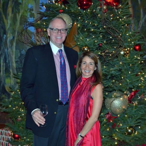 Man and woman in front of a Christmas tree