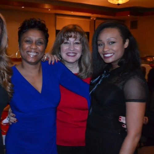 Four women on cocktail dresses